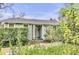 Quaint light green house with well-manicured landscaping at 12 John St # Includes 8 & 10, Charleston, SC 29403