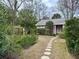 Hexagonal stone path leads to charming pink cottage at 12 John St # Includes 8 & 10, Charleston, SC 29403