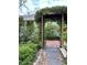 Brick and stone pathway leads to charming pergola at 12 John St # Includes 8 & 10, Charleston, SC 29403