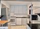 Efficient kitchen with stainless steel appliances and white cabinets at 12 John St # Includes 8 & 10, Charleston, SC 29403