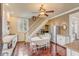 Bright kitchen boasts a round table, stainless steel fridge, and hardwood floors at 12 John St # Includes 8 & 10, Charleston, SC 29403