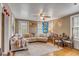 Cozy living room featuring a comfortable sectional sofa and hardwood floors at 12 John St # Includes 8 & 10, Charleston, SC 29403