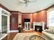 Living room with hardwood floors, fireplace and ceiling fan at 12 John St # Includes 8 & 10, Charleston, SC 29403