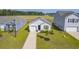 Aerial view of a charming house with a driveway and landscaped yard at 120 Clear Tide Dr, Summerville, SC 29486
