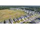 Aerial view of a neighborhood with houses, pond, and open space at 120 Clear Tide Dr, Summerville, SC 29486