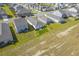 Aerial view of houses and a large open field at 120 Clear Tide Dr, Summerville, SC 29486
