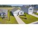 Aerial view of a charming house with a driveway and landscaped yard at 120 Clear Tide Dr, Summerville, SC 29486