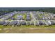 Aerial view of a large neighborhood with houses and ponds at 120 Clear Tide Dr, Summerville, SC 29486