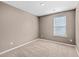 Small bedroom with taupe walls and carpet at 120 Clear Tide Dr, Summerville, SC 29486