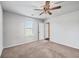 Well-lit bedroom with ceiling fan and access to bathroom at 120 Clear Tide Dr, Summerville, SC 29486