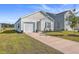 Newly built home with a white exterior, landscaped lawn, and driveway at 120 Clear Tide Dr, Summerville, SC 29486