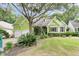 Attractive lime green house with mature trees and manicured lawn at 1287 Hogans Aly, Mount Pleasant, SC 29466