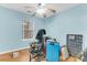 Bedroom with light blue walls, large window, and wood flooring at 141 Penzance Blvd, Goose Creek, SC 29445