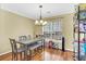 Dining room with gray table and bench, hardwood floors at 141 Penzance Blvd, Goose Creek, SC 29445