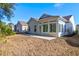 Back exterior showcasing sunroom and patio at 1441 Oldenburg Dr, Mount Pleasant, SC 29429