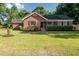 Brick house with a well manicured lawn at 1713 Mcleod Ave, Charleston, SC 29412