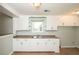 White kitchen cabinets and granite countertops at 1713 Mcleod Ave, Charleston, SC 29412