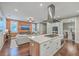 Open concept kitchen with island, stainless steel appliances, and adjacent living area at 1935 Chestnut Oak Ln, Charleston, SC 29414