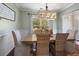 Elegant dining room featuring a wood table and wicker chairs at 2157 Summerwood Dr, Mount Pleasant, SC 29466