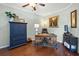 Home office with hardwood floors, desk, and navy blue cabinet at 2157 Summerwood Dr, Mount Pleasant, SC 29466