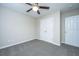 Simple bedroom with double door closet and ceiling fan at 217 Moon Shadow Ln, Summerville, SC 29485