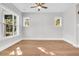 Light-filled living room with hardwood floors and neutral walls at 2241 Norwood Oaks Dr, Mount Pleasant, SC 29466