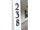 Black house numbers on a white post at 238 Trickle Dr, Summerville, SC 29483