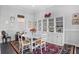 Bright dining room with built-in shelving and hardwood floors at 2434 Racquet Club Dr, Seabrook Island, SC 29455