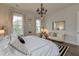 Spacious bedroom with a king-size bed, sitting area, and chandelier at 2545 Hatch Dr, Johns Island, SC 29455