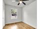 Bright bedroom with hardwood floors and a ceiling fan at 2720 W Surrey Dr, North Charleston, SC 29405