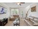 Spacious living room with beige sofas and a large TV at 3286 Hartwell St, Johns Island, SC 29455