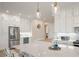 Modern kitchen island with white cabinets and marble countertop at 3518 Shipwatch Rd # Share F, Kiawah Island, SC 29455