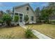 Tan house exterior with landscaping and walkway at 4117 E Amy Ln, Johns Island, SC 29455