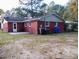 Brick home with a large backyard and access to the back door at 7660 Crossgate Blvd, North Charleston, SC 29420