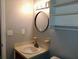 Clean bathroom with a vanity, sink, and large mirror at 7660 Crossgate Blvd, North Charleston, SC 29420