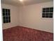Bedroom with two windows and carpet at 7660 Crossgate Blvd, North Charleston, SC 29420