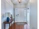 Bright entryway with hardwood floors and console table at 7720 Kinston St, North Charleston, SC 29418