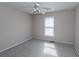 Simple carpeted bedroom with a window and ceiling fan at 891 Portabella Ln, Charleston, SC 29412