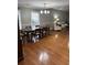 Dining room with hardwood floors, a wooden table, and chairs at 9049 Delancey Cir, North Charleston, SC 29406