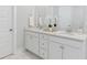 Elegant bathroom with double vanity and marble flooring at 203 Denham St, Summerville, SC 29486