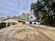 Large backyard with an inground pool and mature trees at 208 Howard St, Varnville, SC 29944