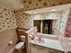 Pink bathroom with vintage tile and vanity at 208 Howard St, Varnville, SC 29944