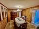 Classic dining room with wood paneling and chandelier at 208 Howard St, Varnville, SC 29944