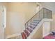 Indoor staircase with a metal railing and hardwood steps at 212 Glenda View, Ladson, SC 29456