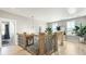 Bright upstairs hallway with wood flooring and a chic chandelier at 215 Brightside Trl, Summerville, SC 29483