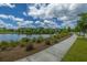 Scenic community lake with a walking path and homes at 248 Great Lawn Dr, Summerville, SC 29486