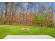 Backyard with fire pit and tree line at 261 Old Carolina Dr, Goose Creek, SC 29445