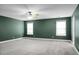 Bedroom with green walls, ceiling fan and carpet at 261 Old Carolina Dr, Goose Creek, SC 29445