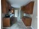 Simple kitchen with light brown cabinets and tile flooring at 268 Homer Dr, Cross, SC 29436