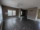 Spacious living room featuring dark gray laminate flooring at 268 Homer Dr, Cross, SC 29436